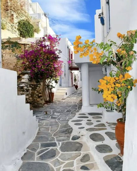 Paved Cycladic stone alleyways and whitewashed arches in Kastro village